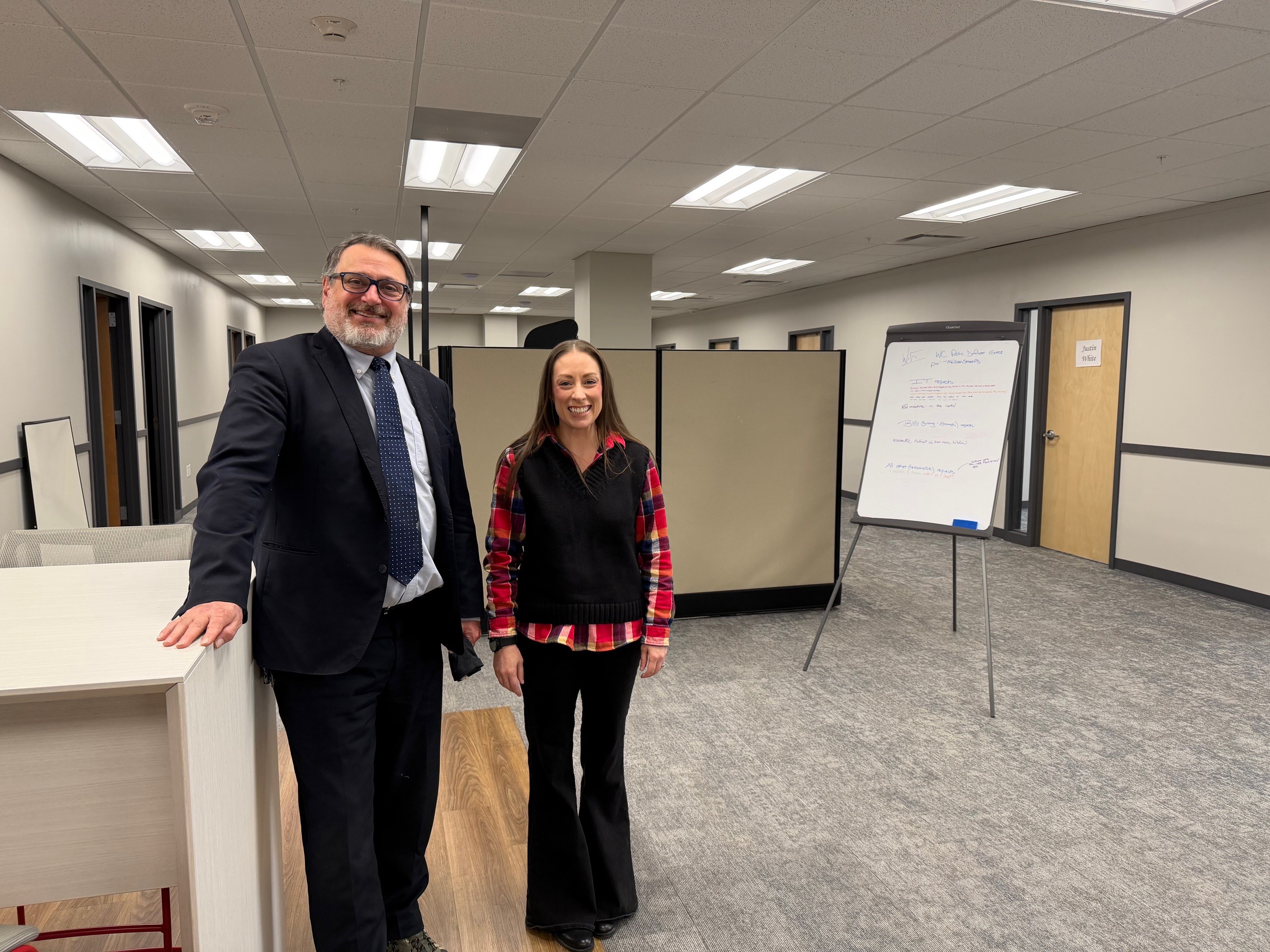 Warren County Public Defender Greg Canale and First Assistant Erin Komon pose in their new Glens Falls office.