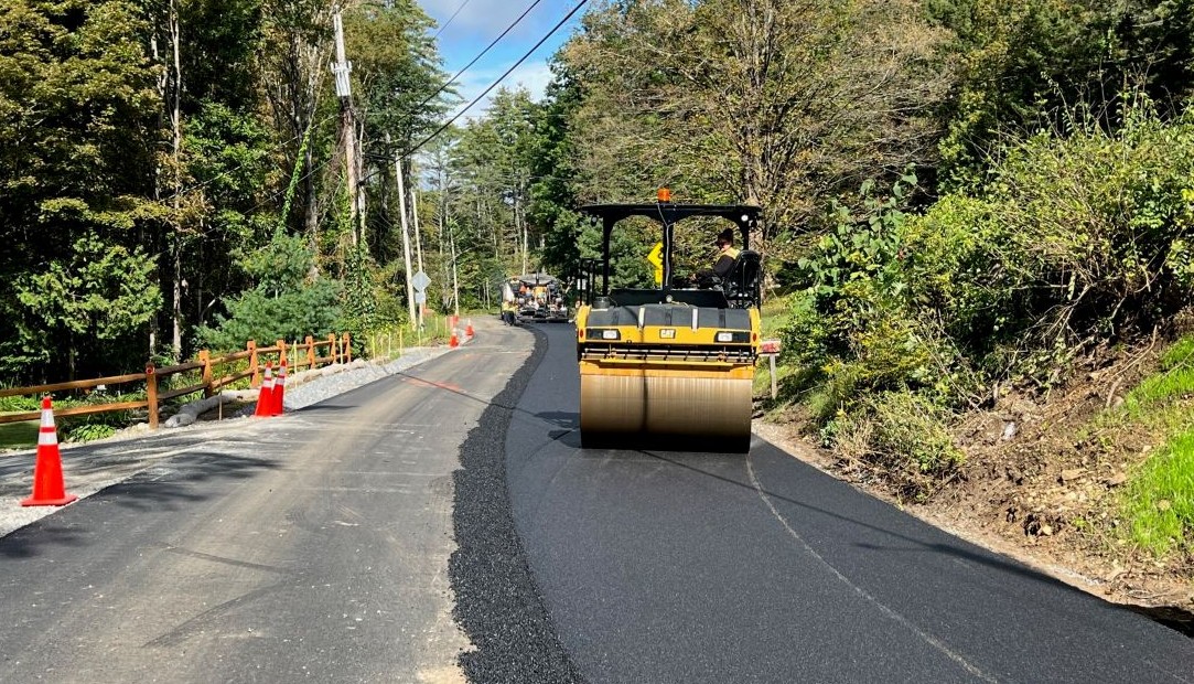 paver putting down pavement on coolidge road in lake george