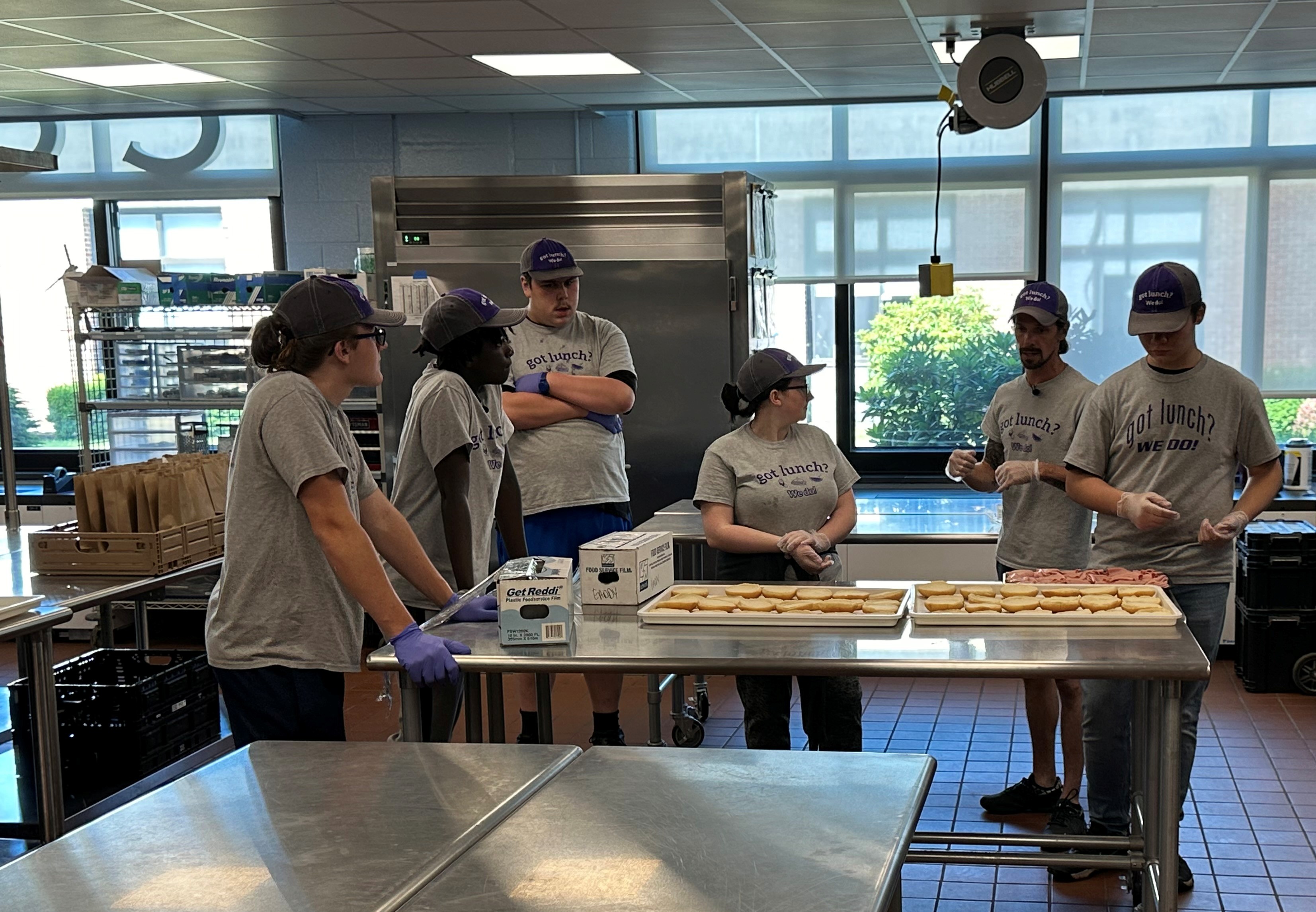 Workers in Warren County Summer Youth Employment program prepare lunch for a student meal program in June 2024