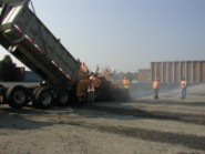 Dump Truck spreading asphalt