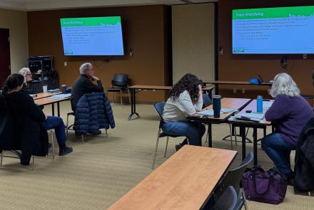 Picture of seven menbers of Warren County's Community Emergency Response Team meeting in a classroom for training