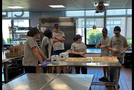 Workers in Warren County Summer Youth Employment program prepare lunch for a student meal program in June 2024
