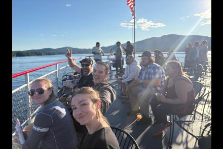 photo showing people celebrating aboard a lake george tour boat