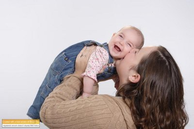 Mom kissing baby